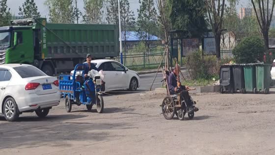 Man in wheelchair pulls tricycle in Heilongjiang, China