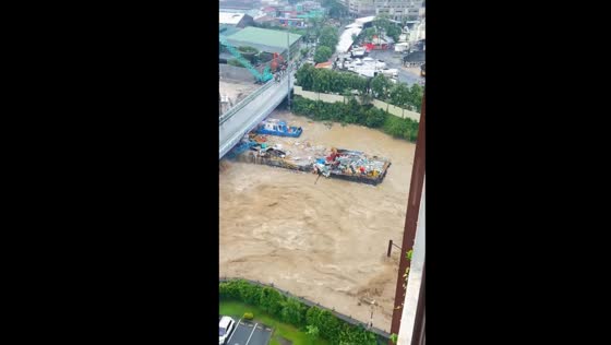 Typhoon Gaemi causes barges to collide and overturn under Caruncho Bridge in Pasig City