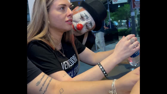 Clown startles woman with unexpected close approach