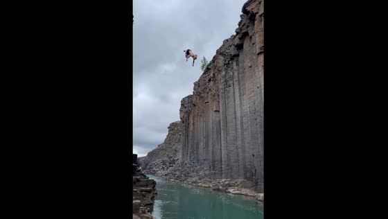 Man jumps off cliff into water in Egilsstaðir, Iceland