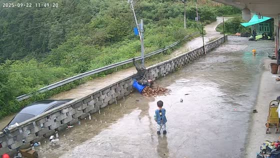 Man loses balance carrying heavy bucket in Yunnan, China