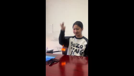 Girl makes paper float with fire trick in Ningxia, China