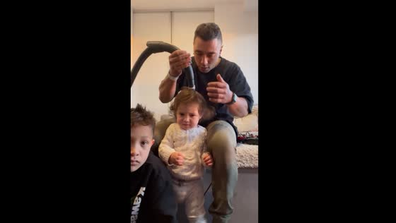 Vacuum magic: dad's clever hair styling trick wins hearts